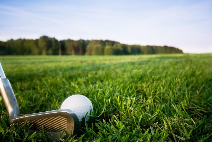 Golf club and ball. Preparing to shot